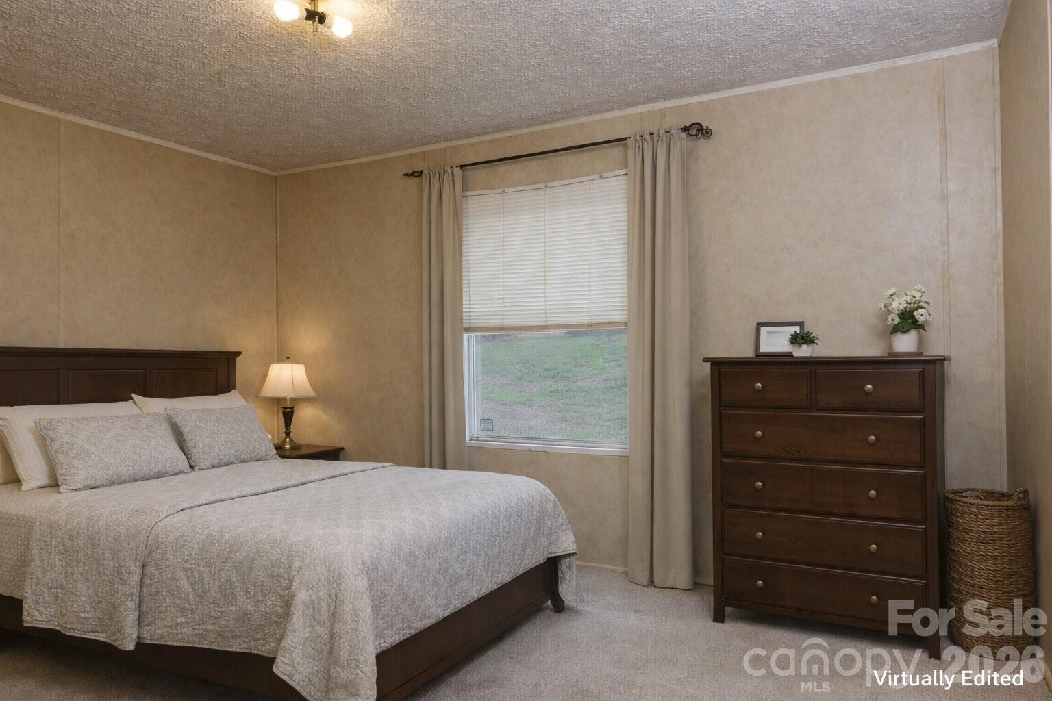 133 Birdie Watson Drive Rutherfordton, NC 28139 - Photo 2 of 9 a bedroom with a bed and a dresser