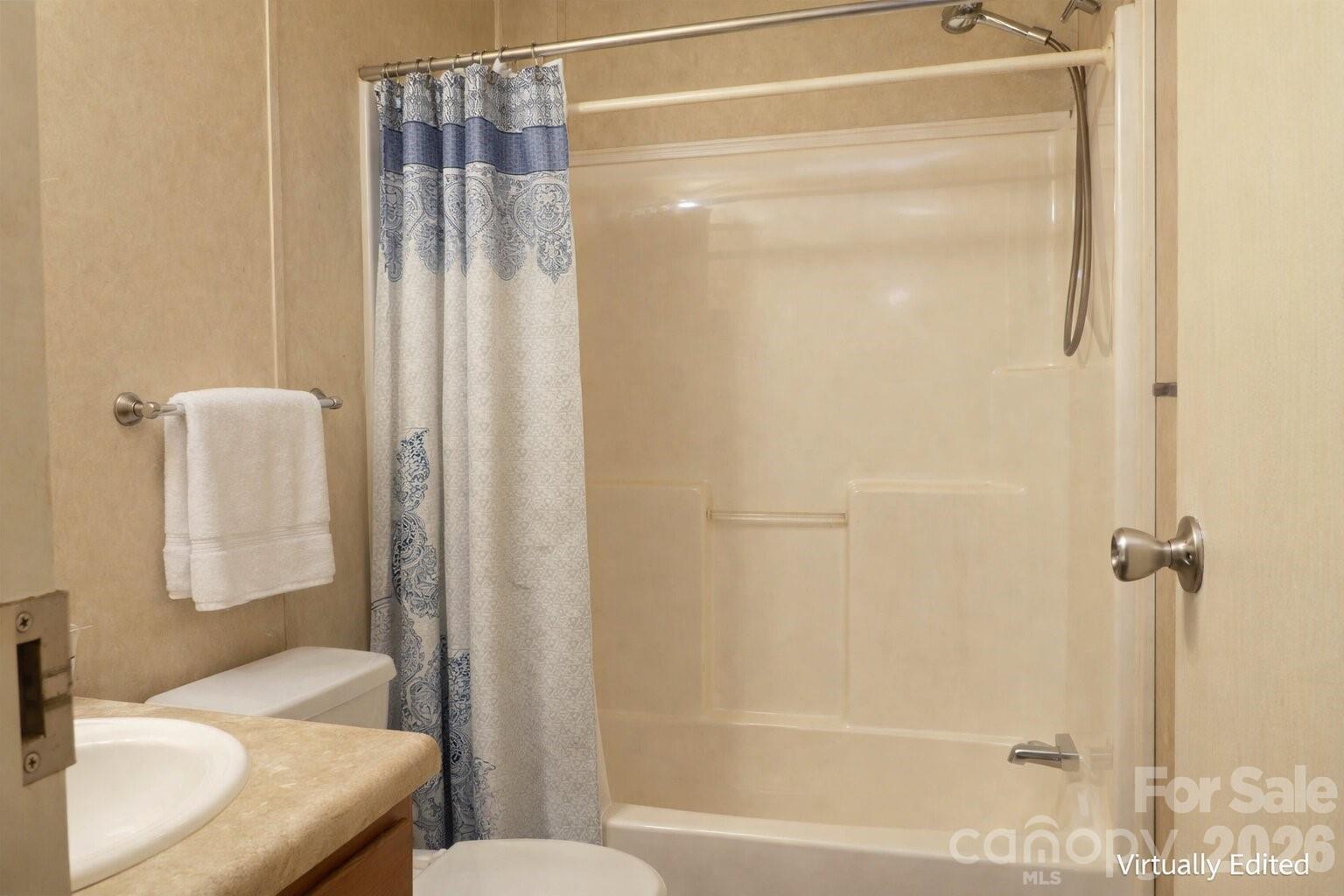 133 Birdie Watson Drive Rutherfordton, NC 28139 - Photo 4 of 9 a bathroom with a shower curtain and a sink