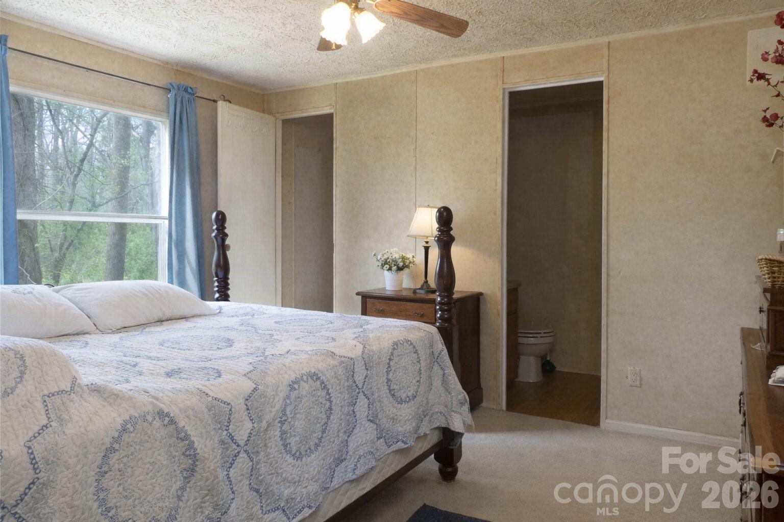 133 Birdie Watson Drive Rutherfordton, NC 28139 - Photo 5 of 9 a bedroom with a bed and a large window