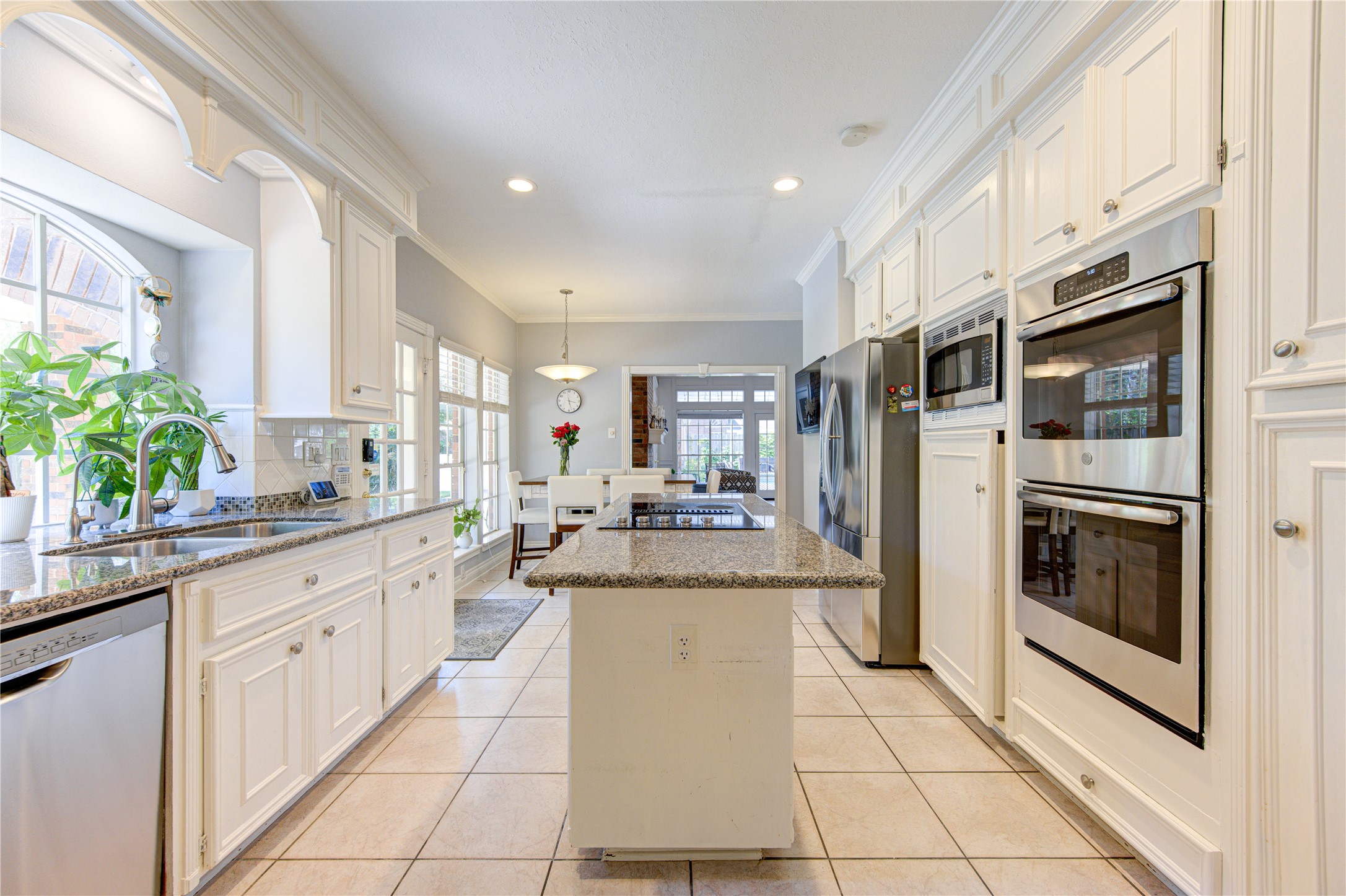 3622 Springhill Lane Sugar Land, TX 77479 - Photo 11 of 50 a large white kitchen with stainless steel appliances granite countertop a stove and a sink
