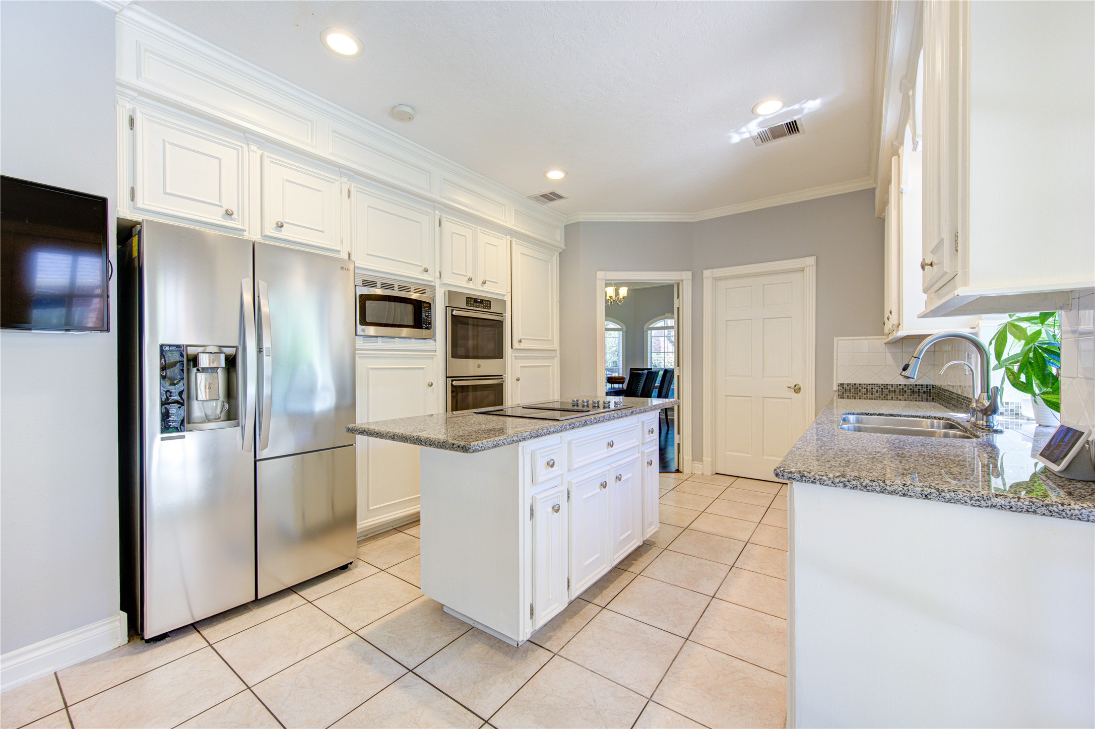 3622 Springhill Lane Sugar Land, TX 77479 - Photo 12 of 50 a kitchen with granite countertop a refrigerator and a sink
