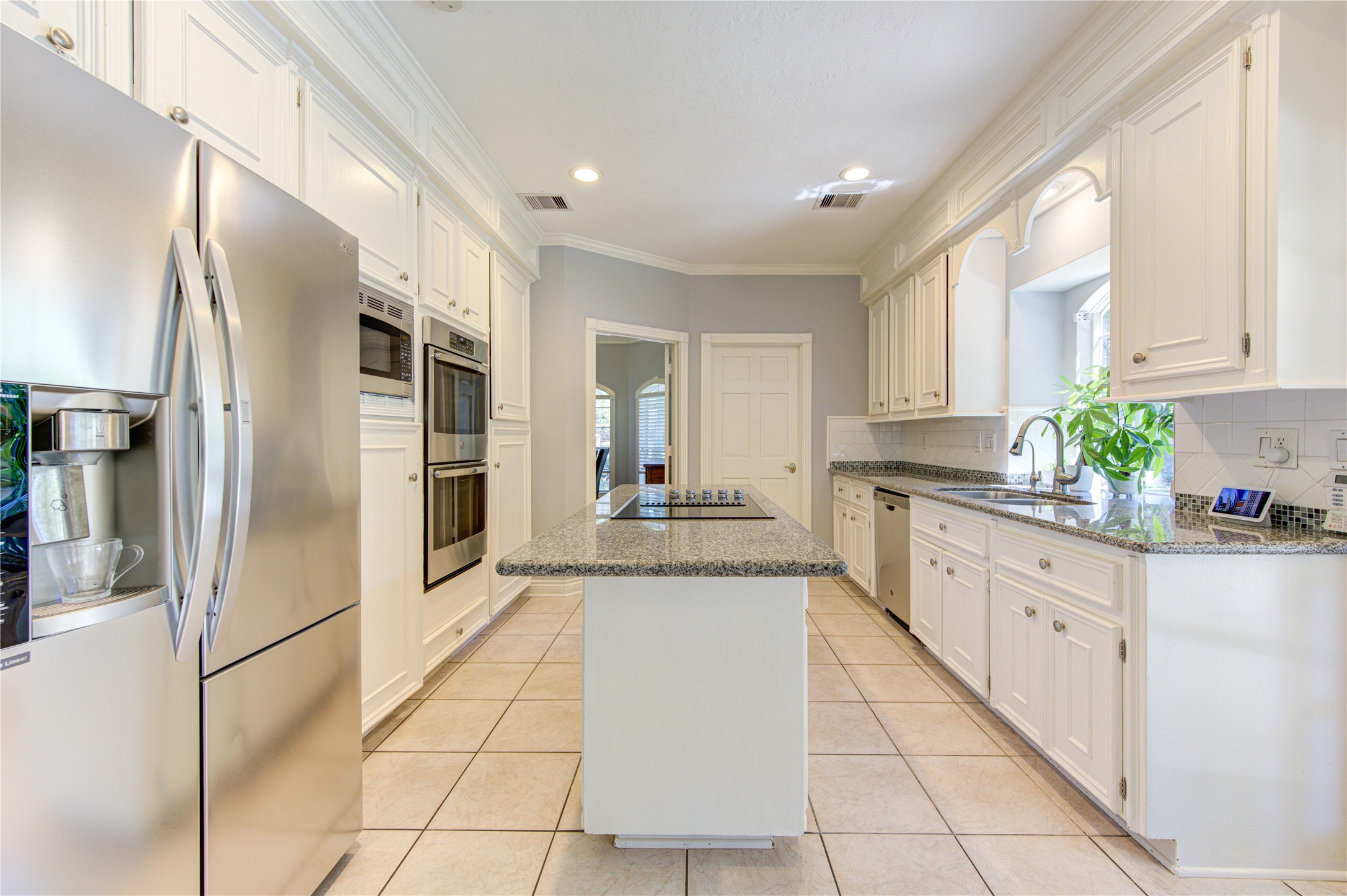 3622 Springhill Lane Sugar Land, TX 77479 - Photo 14 of 50 a large kitchen with cabinets and stainless steel appliances