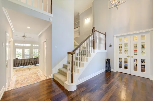 a view of an entryway with wooden floor and door