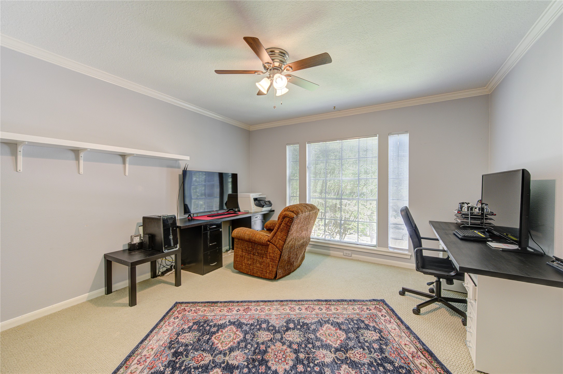 3622 Springhill Lane Sugar Land, TX 77479 - Photo 35 of 50 a living room with furniture and a flat screen tv with wooden floor