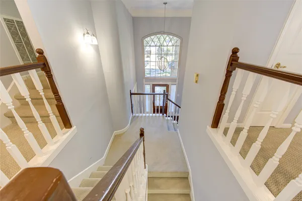 a view of an entryway with wooden floor