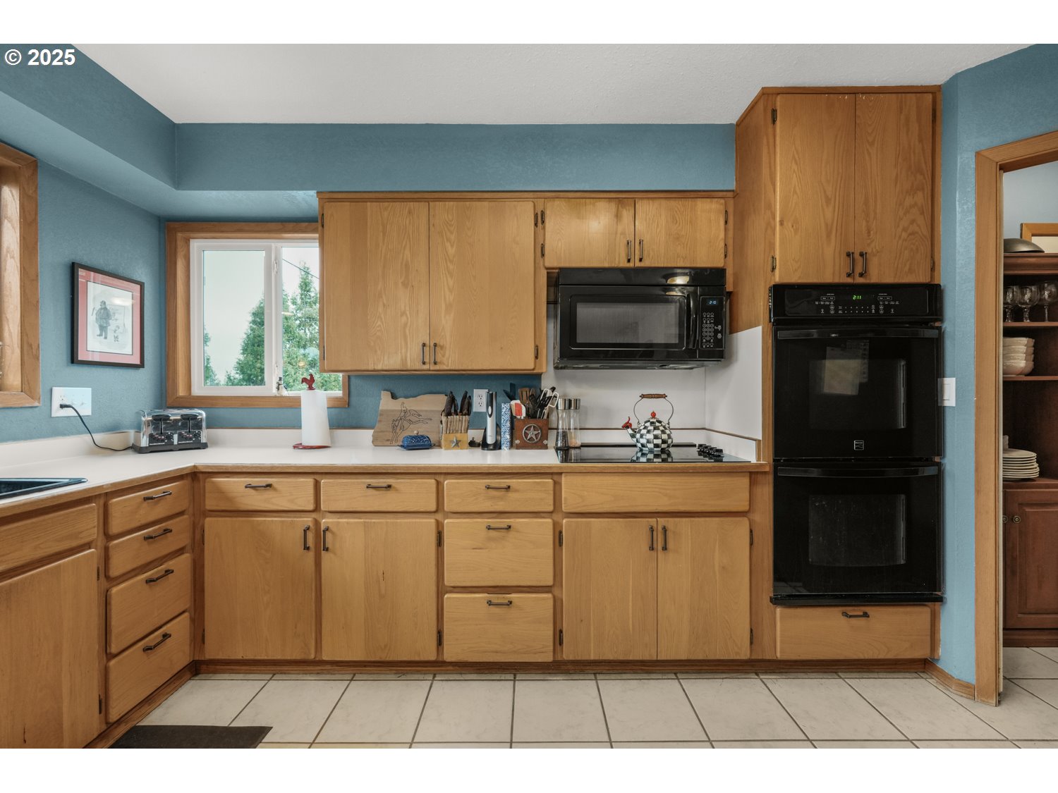 4644 Glen Echo Way Central Point, OR 97502 - Photo 12 of 42 a kitchen with stainless steel appliances a sink cabinets and a large window