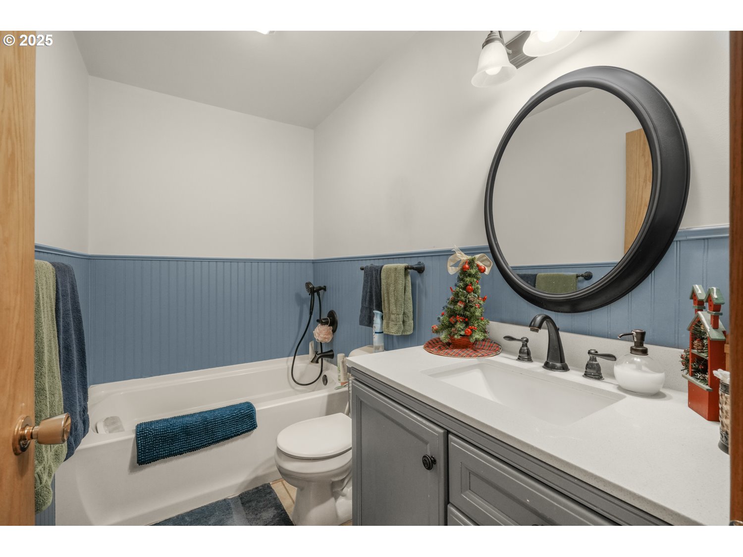 4644 Glen Echo Way Central Point, OR 97502 - Photo 16 of 42 a bathroom with a sink a toilet and a mirror