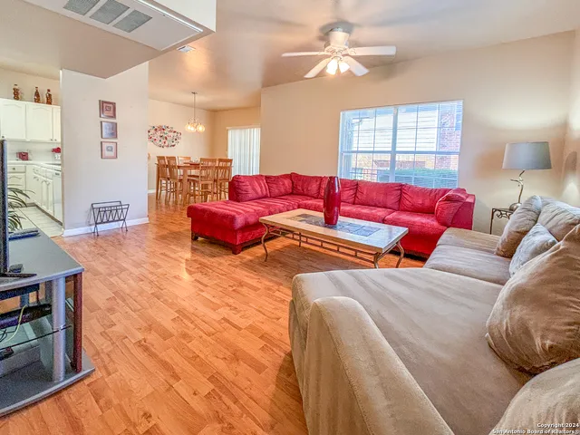 a living room with furniture and a window