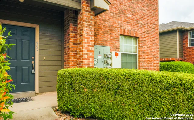 a brick house with a large windows