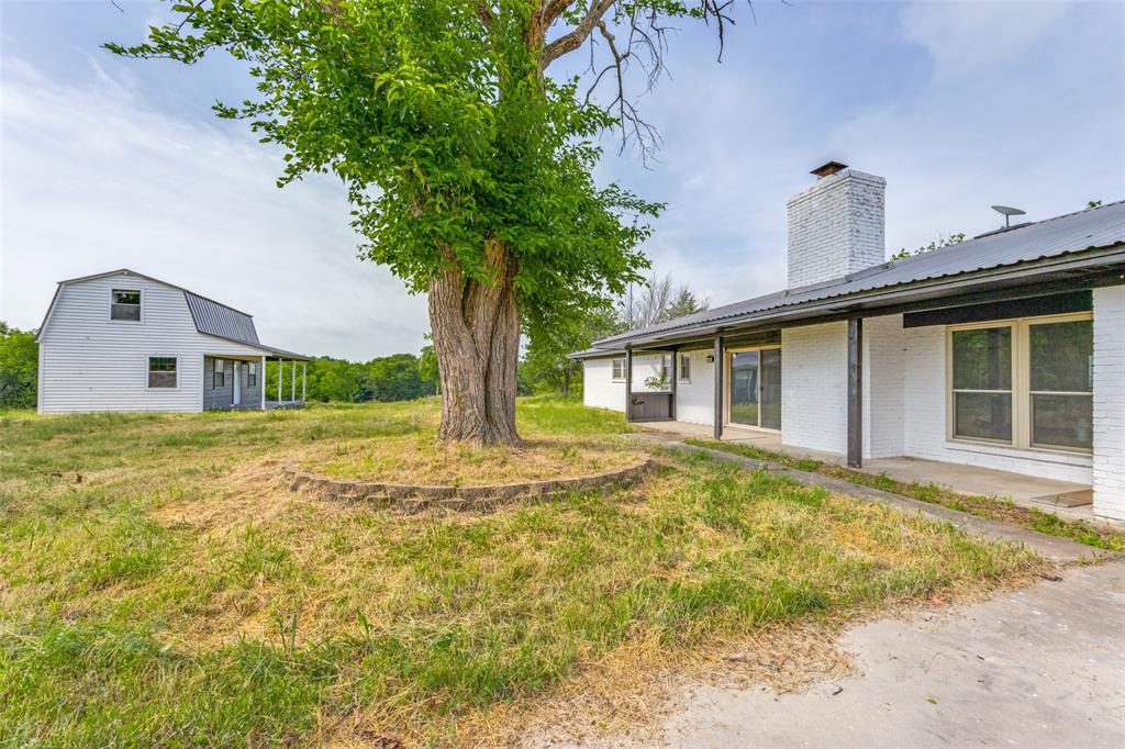738 Campground Road Sherman, TX 75090 - Photo 10 of 40 a front view of a house with garden