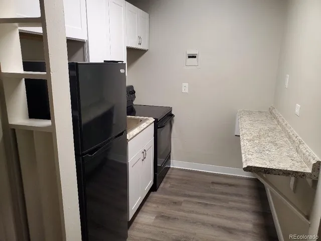 a kitchen with appliances and cabinets