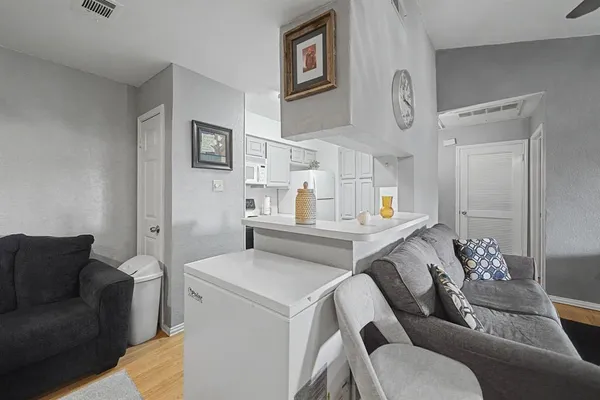 a living room with furniture and a table