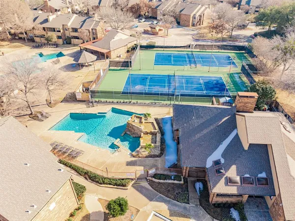 a view of a swimming pool with a patio