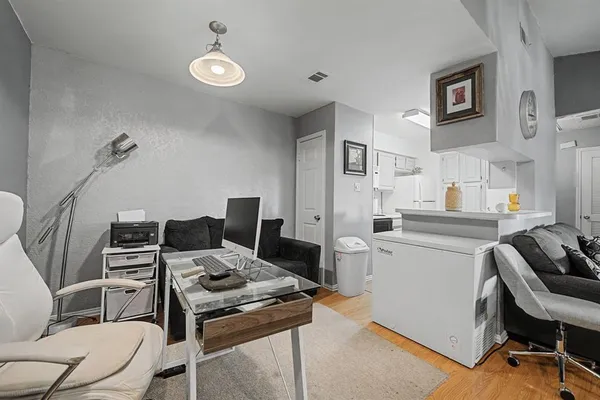 a kitchen with a stove and a refrigerator
