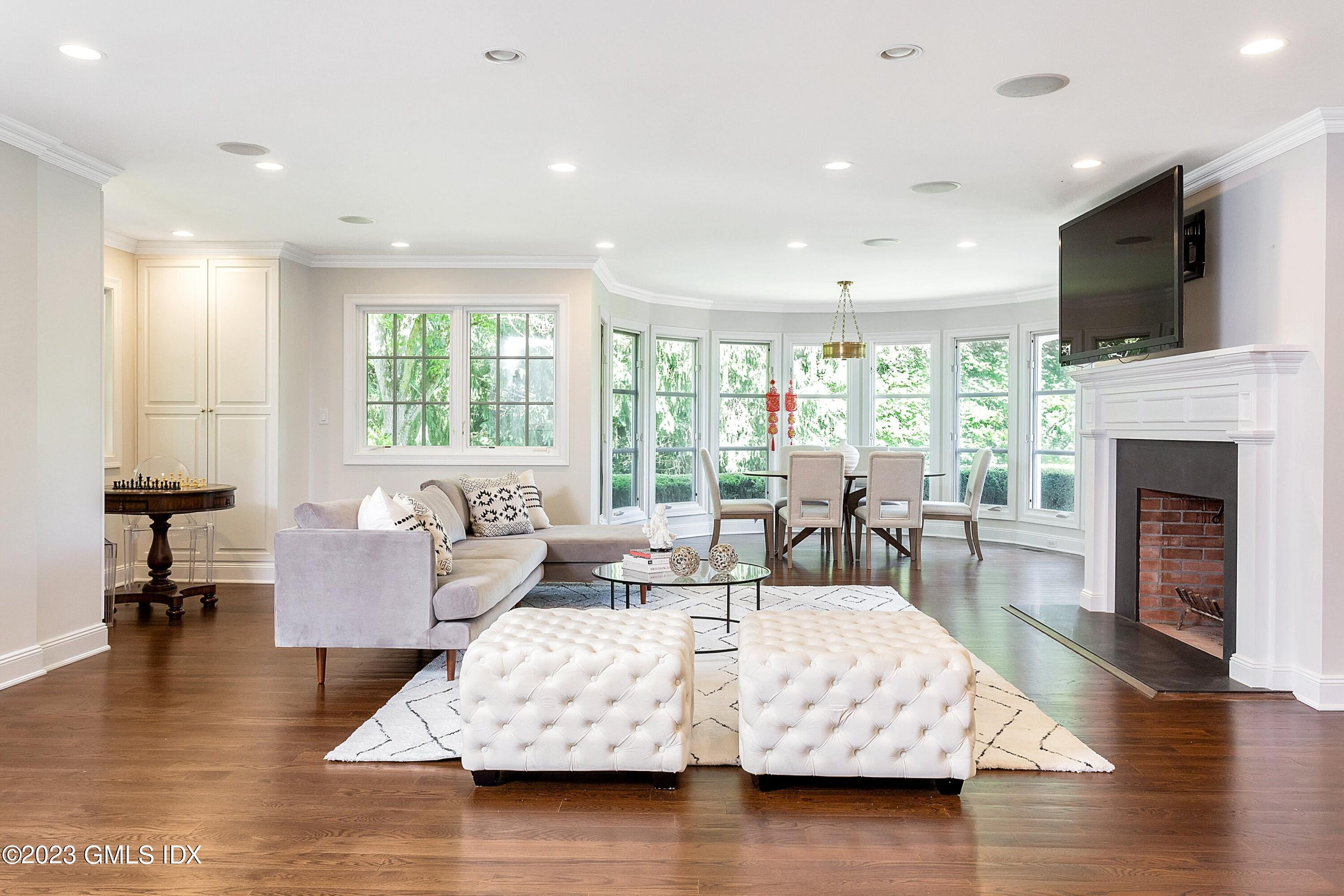 357 Round Hill Road Greenwich, CT 06831 - Photo 12 of 52 a living room with fireplace furniture and a flat screen tv