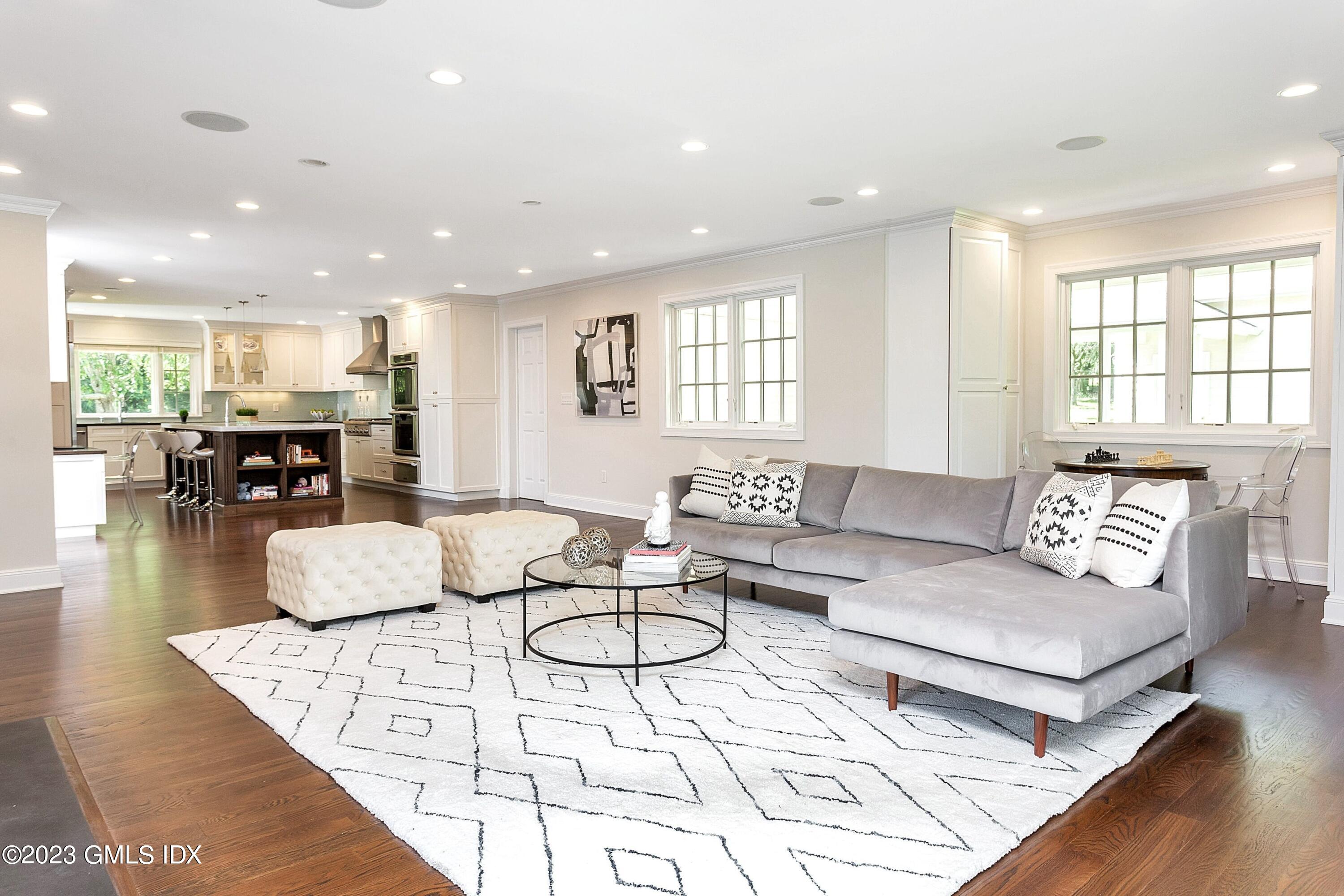 357 Round Hill Road Greenwich, CT 06831 - Photo 14 of 52 a living room with furniture kitchen view and a table