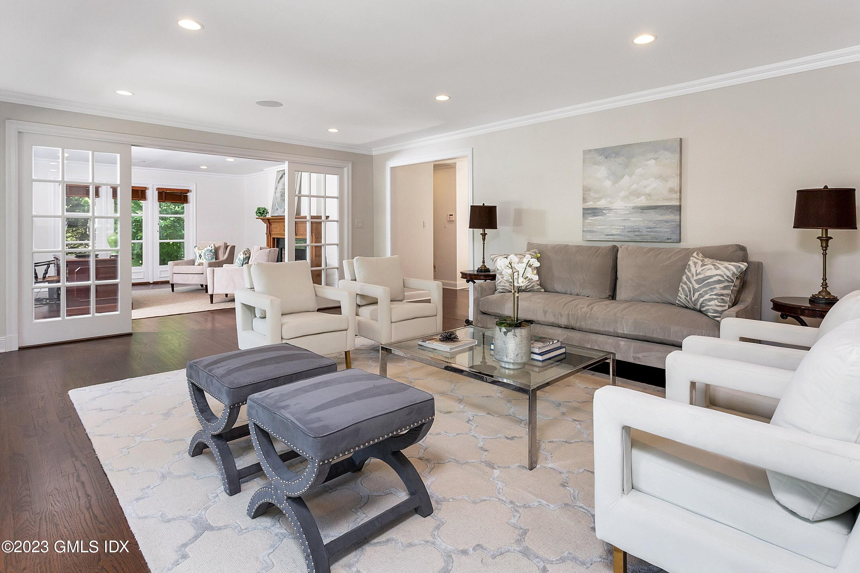 357 Round Hill Road Greenwich, CT 06831 - Photo 17 of 52 a living room with furniture and a wooden floor