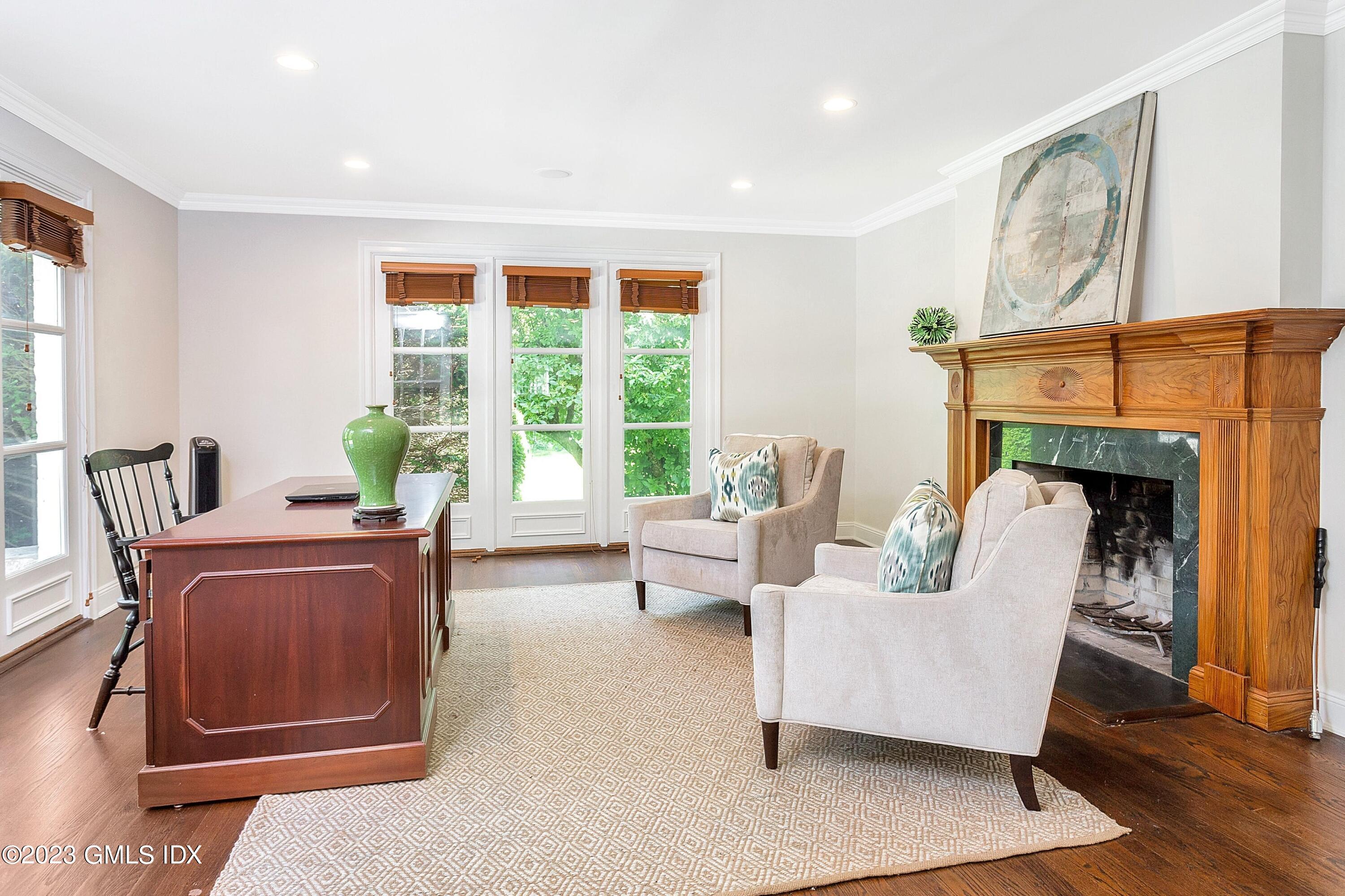 357 Round Hill Road Greenwich, CT 06831 - Photo 18 of 52 a living room with furniture and a fireplace