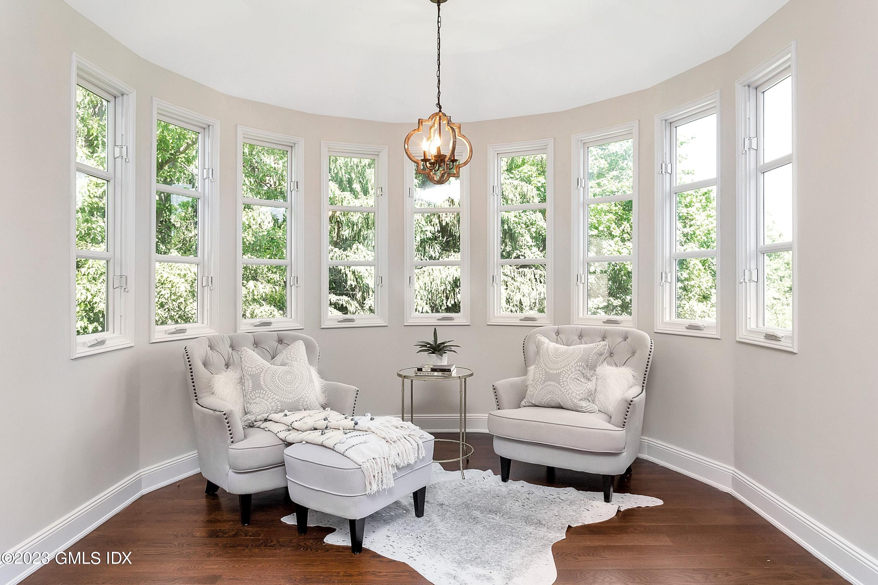 357 Round Hill Road Greenwich, CT 06831 - Photo 22 of 52 a living room with furniture and a large window