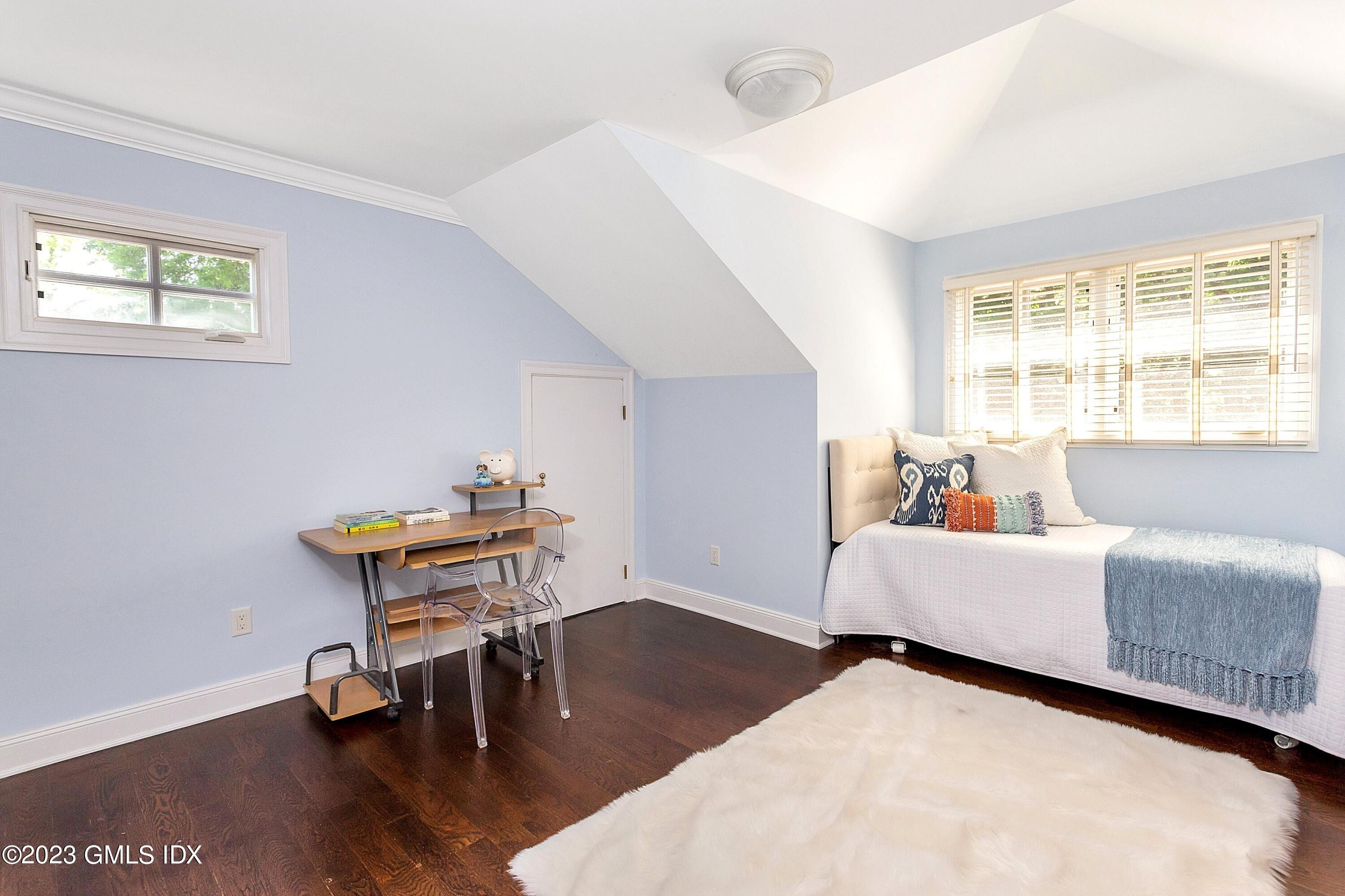 357 Round Hill Road Greenwich, CT 06831 - Photo 26 of 52 a living room with furniture and a window