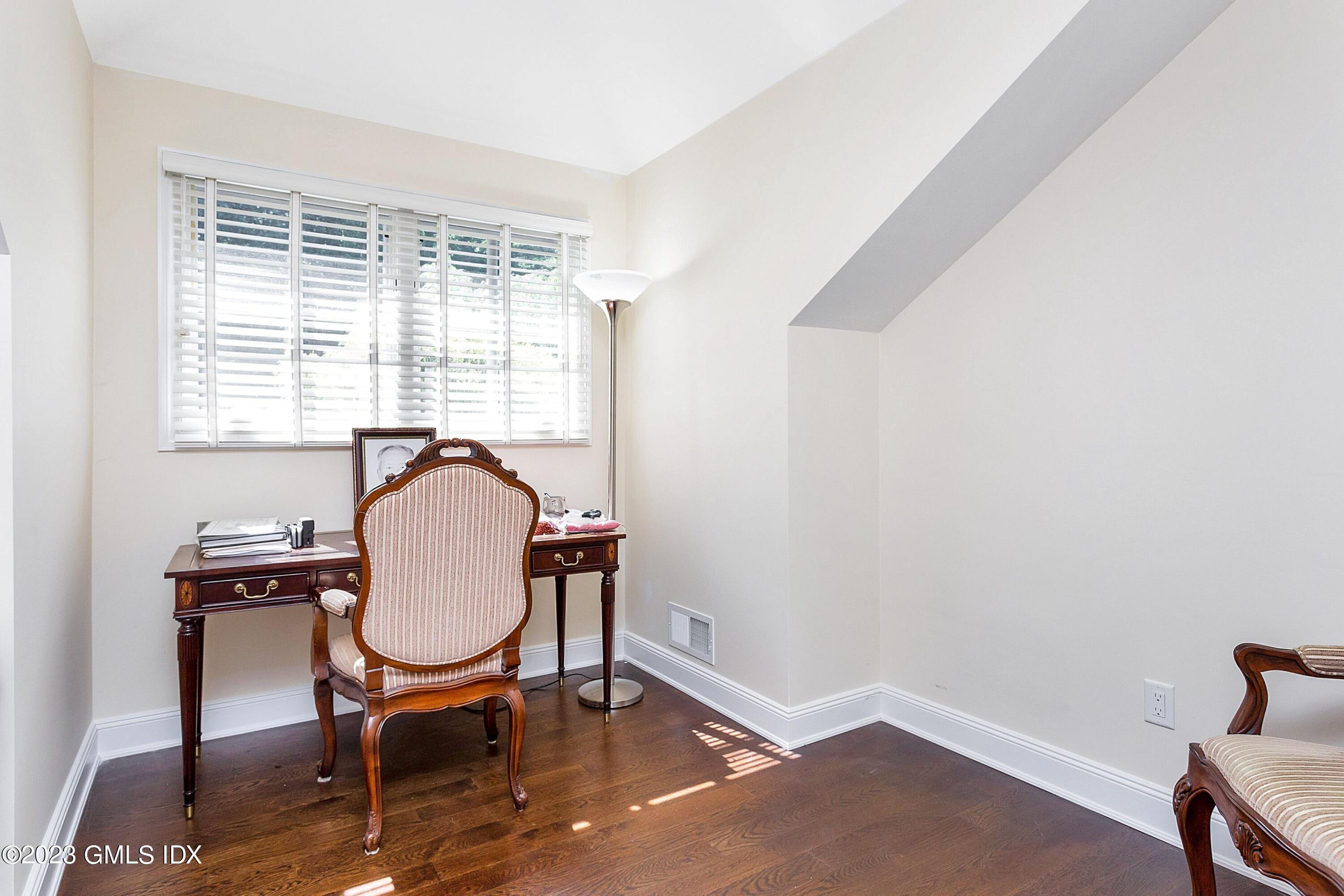 357 Round Hill Road Greenwich, CT 06831 - Photo 30 of 52 a workspace with furniture window and wooden floor