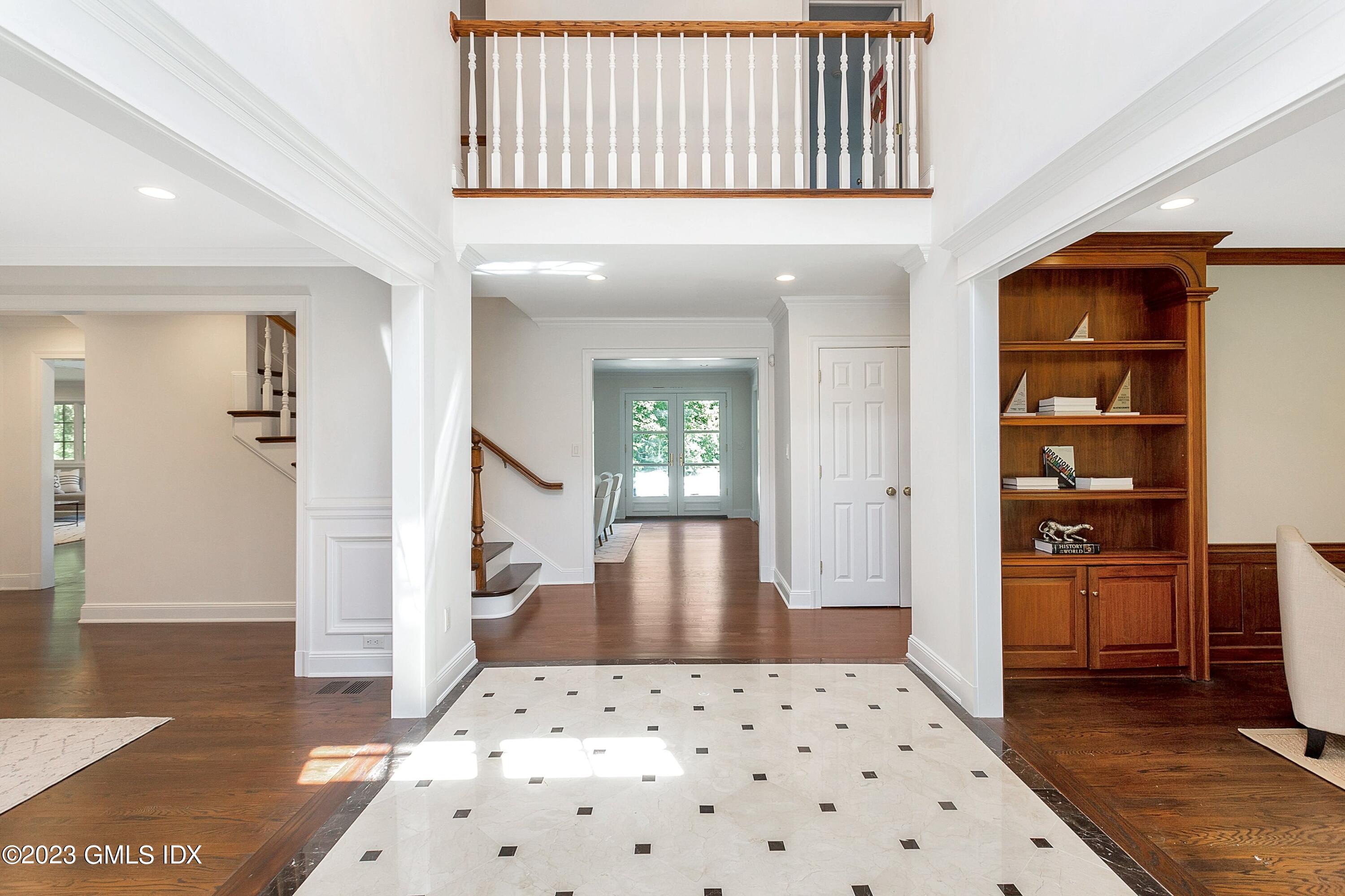 357 Round Hill Road Greenwich, CT 06831 - Photo 3 of 52 a view of a living room with furniture and wooden floor