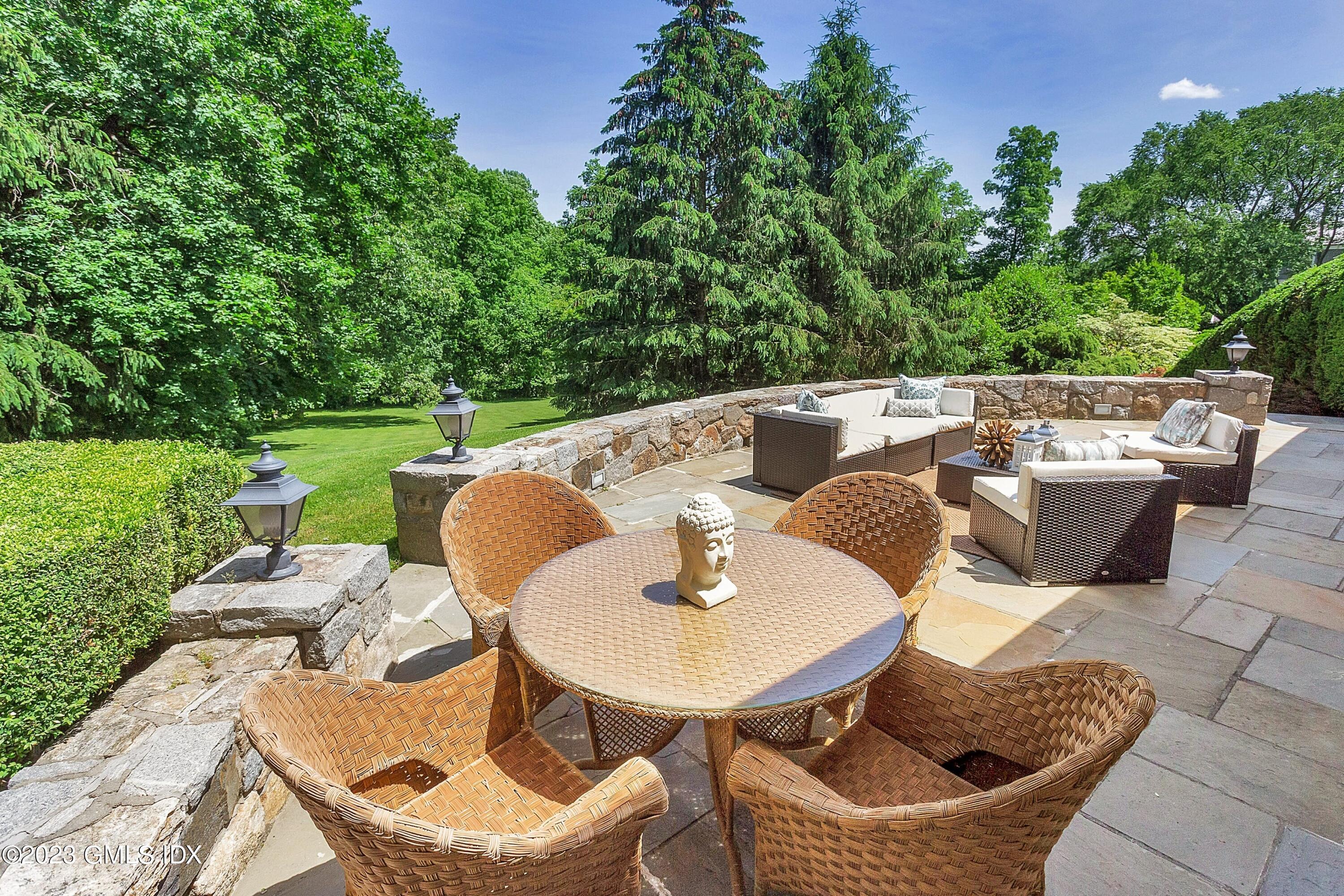 357 Round Hill Road Greenwich, CT 06831 - Photo 34 of 52 a balcony with a table and chairs