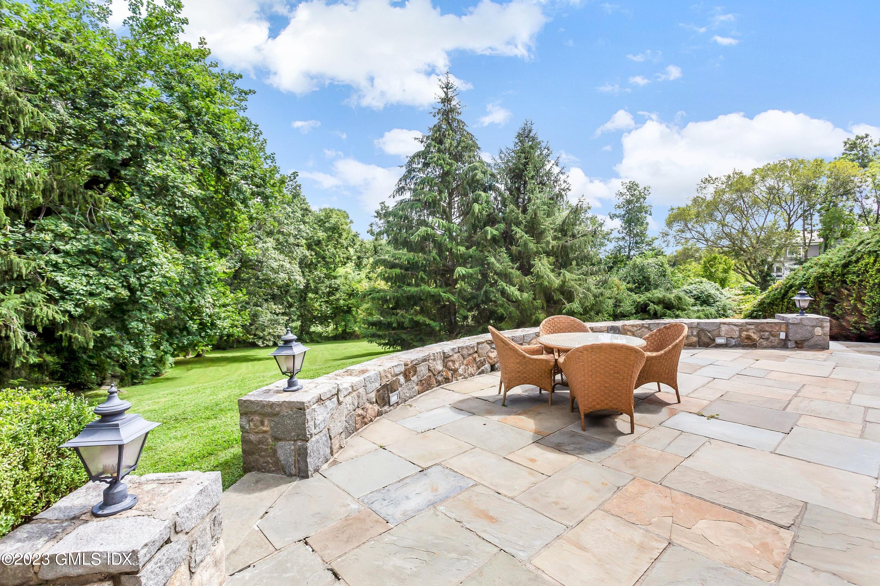 357 Round Hill Road Greenwich, CT 06831 - Photo 36 of 52 a outdoor view with a sitting space