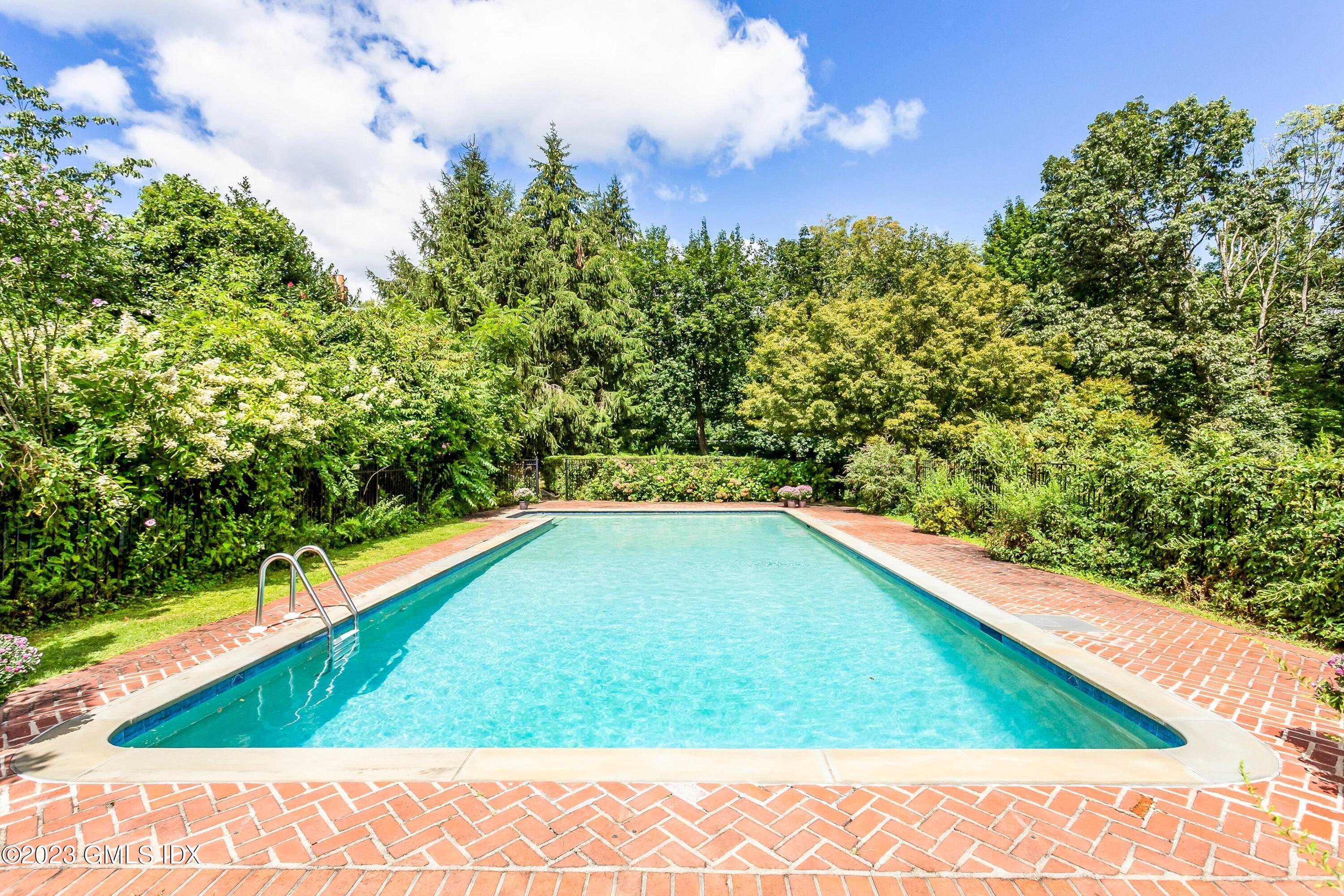 357 Round Hill Road Greenwich, CT 06831 - Photo 37 of 52 a view of a swimming pool from a balcony