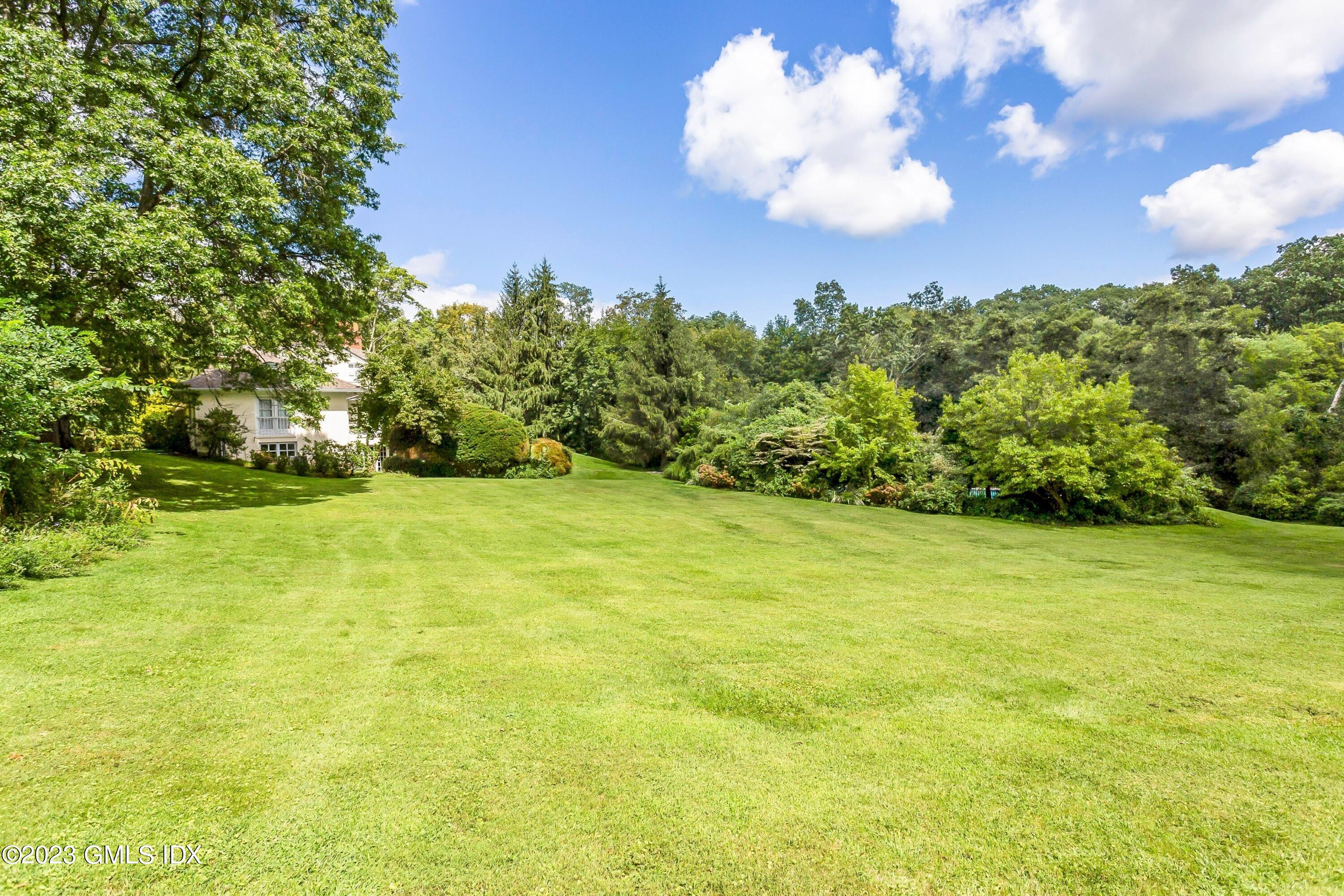 357 Round Hill Road Greenwich, CT 06831 - Photo 38 of 52 a view of a field with an trees