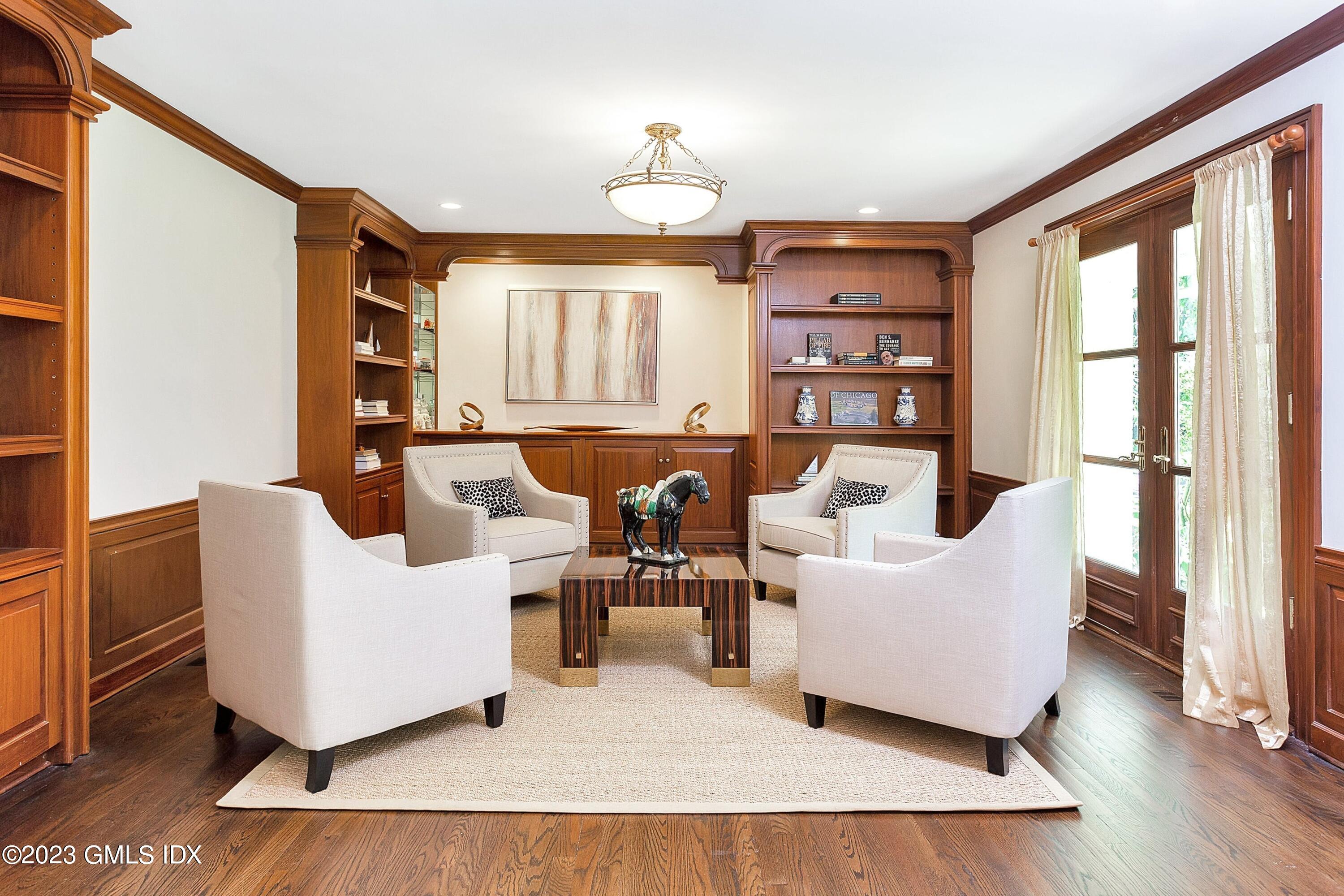 357 Round Hill Road Greenwich, CT 06831 - Photo 4 of 52 a living room with furniture and a large window