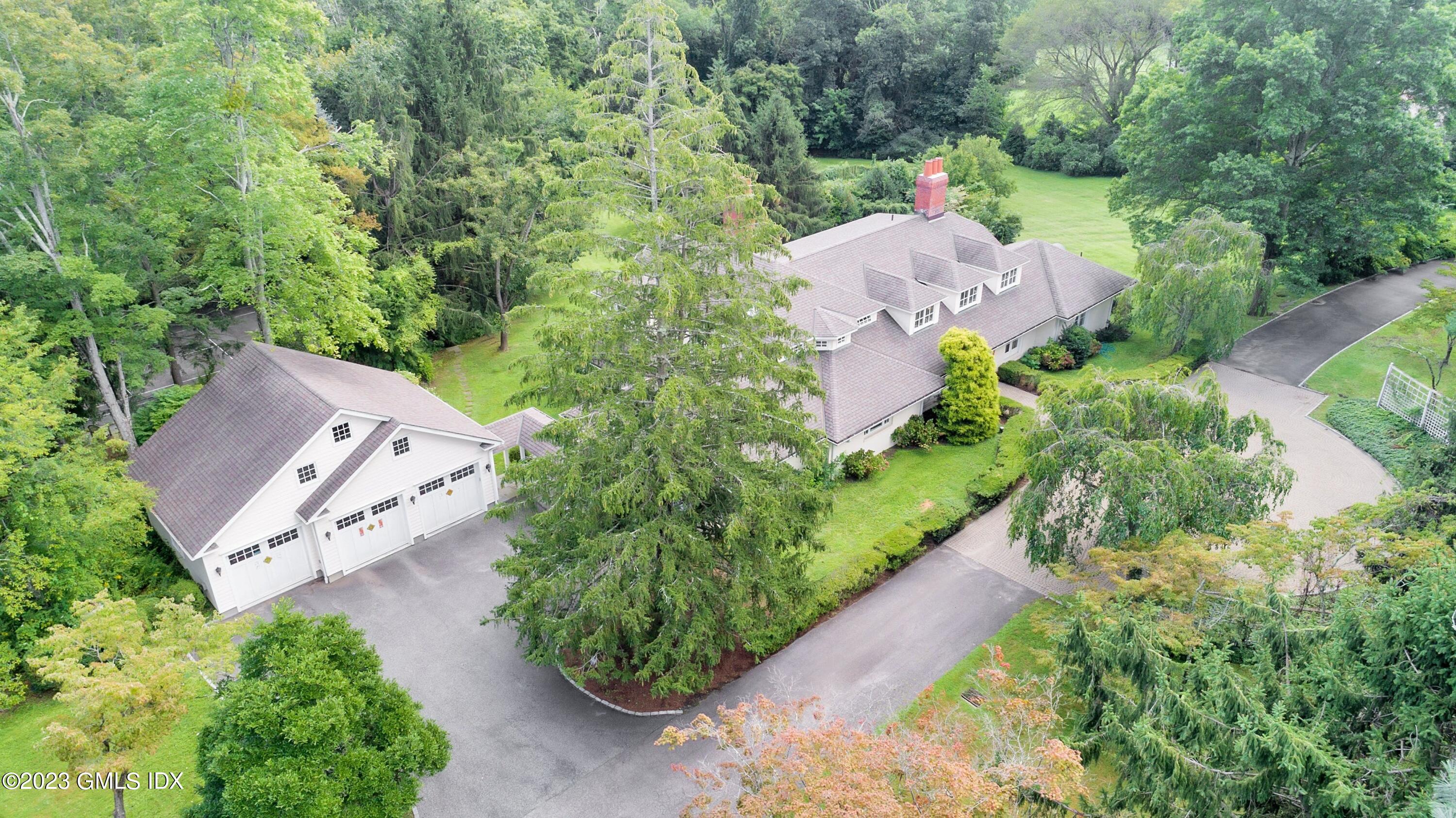 357 Round Hill Road Greenwich, CT 06831 - Photo 41 of 52 an aerial view of a house with a yard