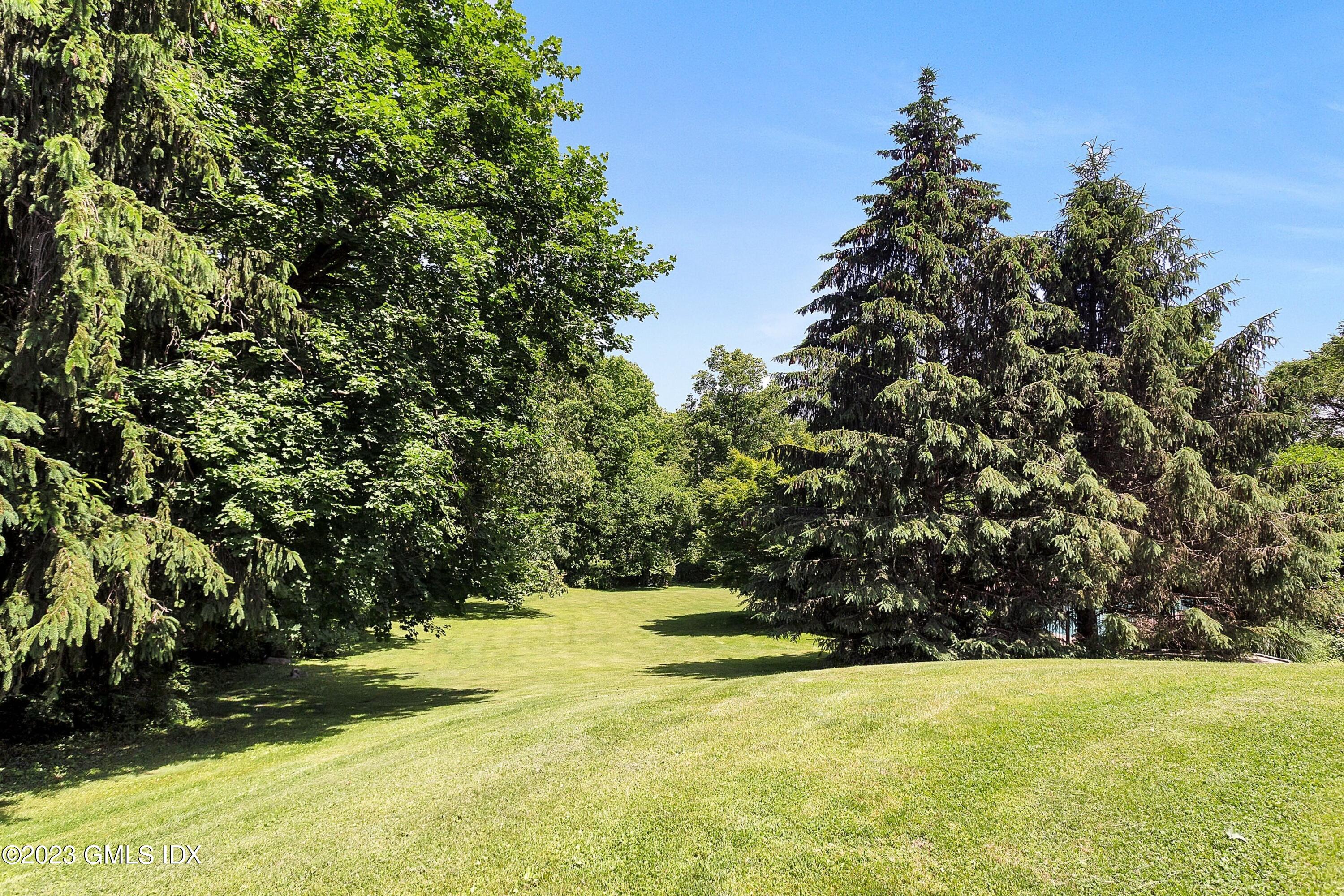 357 Round Hill Road Greenwich, CT 06831 - Photo 42 of 52 a view of yard with trees