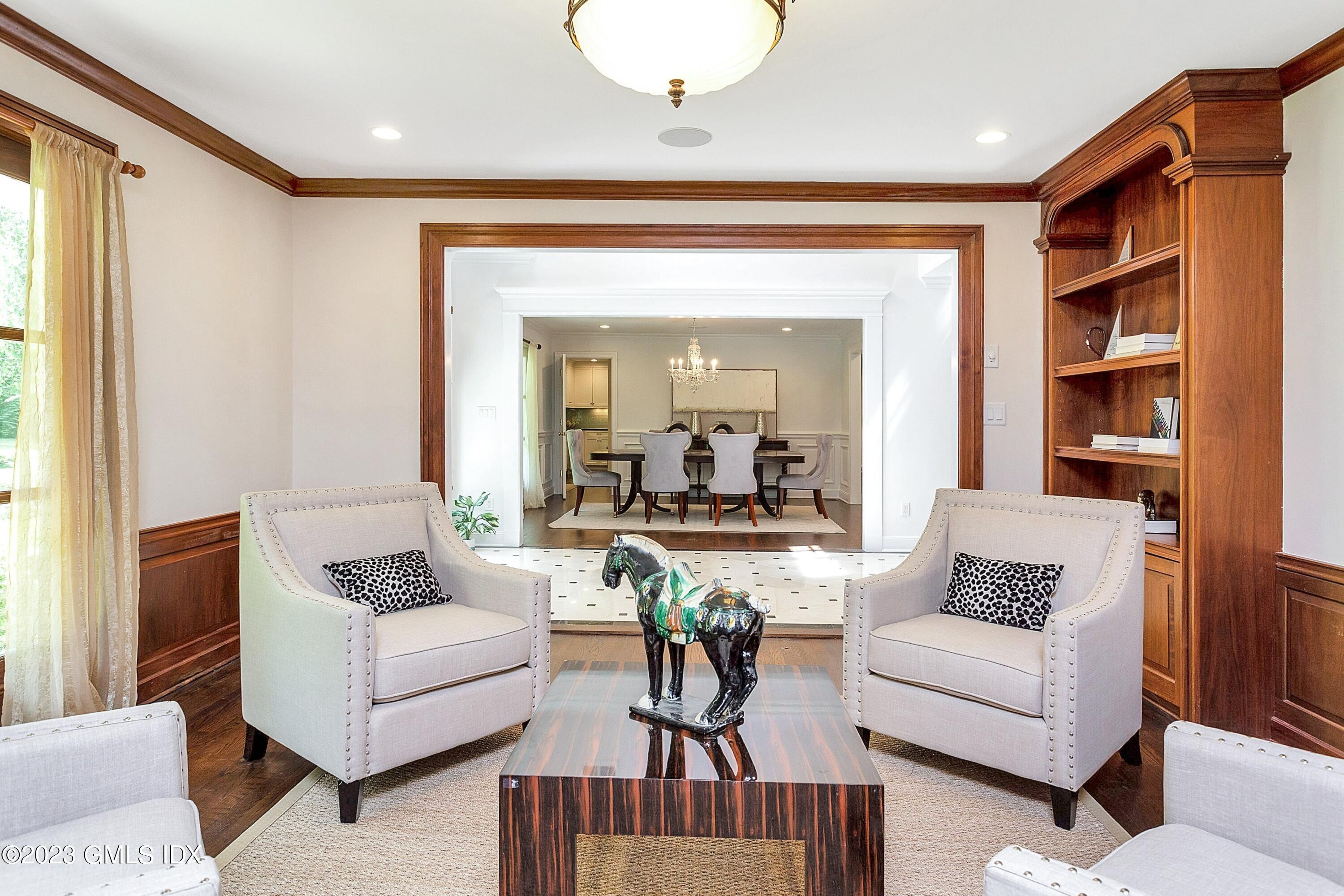 357 Round Hill Road Greenwich, CT 06831 - Photo 5 of 52 a living room with furniture and a large window