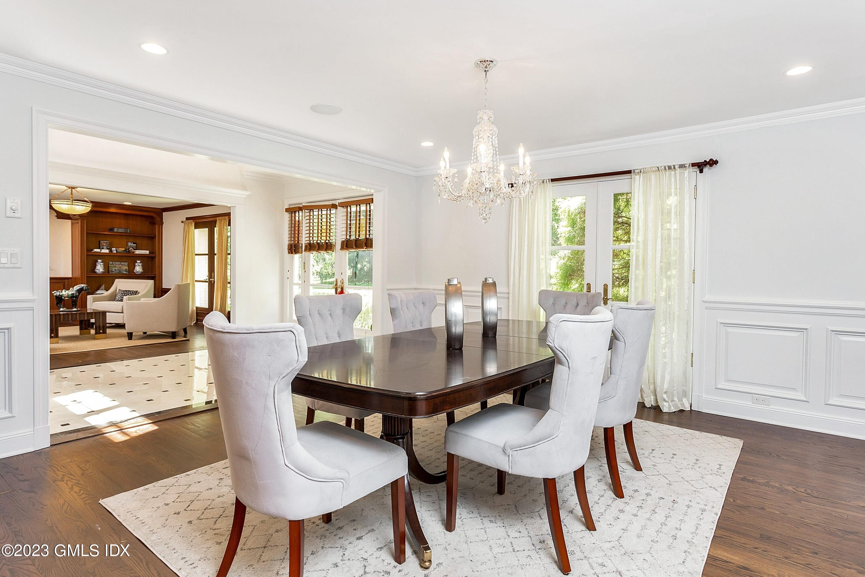 357 Round Hill Road Greenwich, CT 06831 - Photo 6 of 52 a view of a dining room with furniture and wooden floor