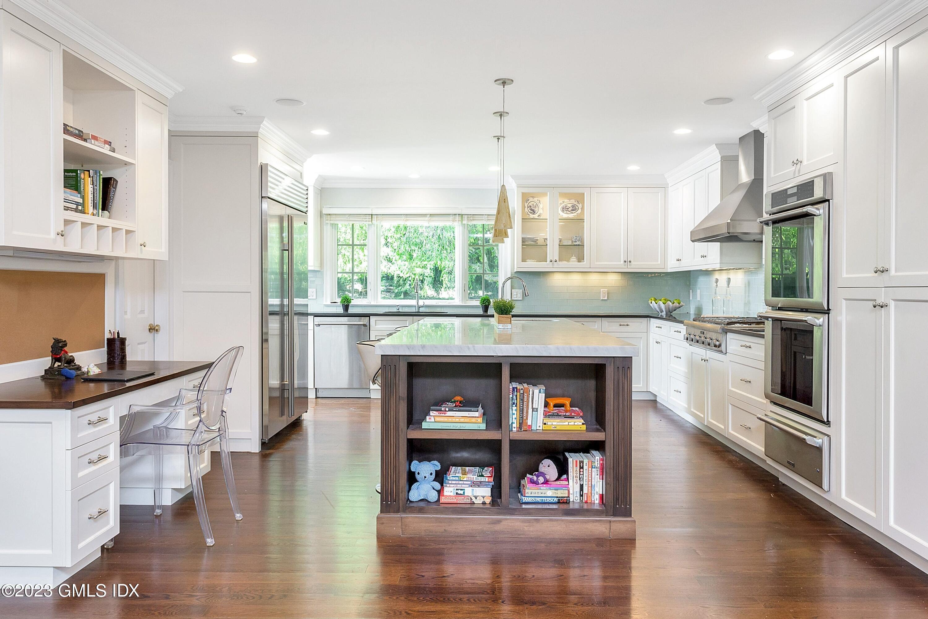 357 Round Hill Road Greenwich, CT 06831 - Photo 8 of 52 a kitchen with stainless steel appliances granite countertop a stove and a refrigerator