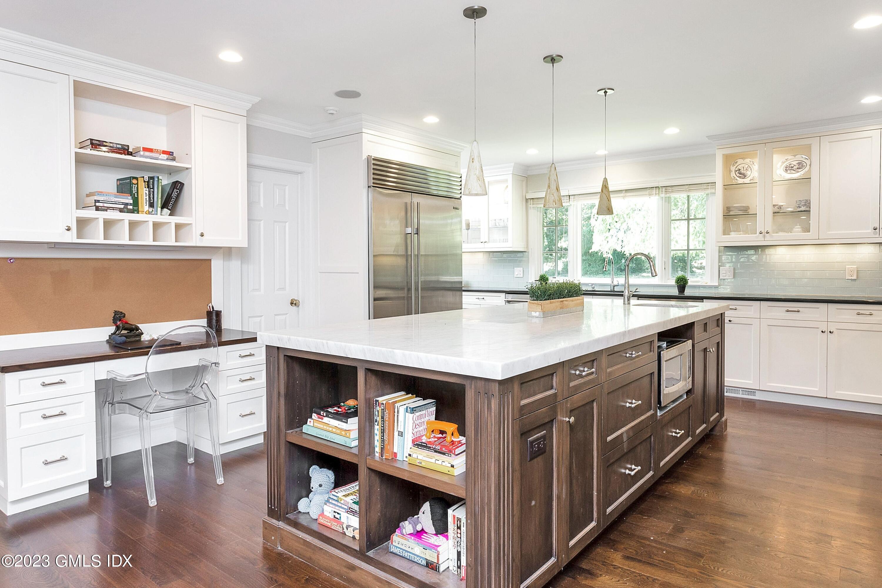 357 Round Hill Road Greenwich, CT 06831 - Photo 9 of 52 a kitchen with stainless steel appliances granite countertop a stove a sink and a wooden floors