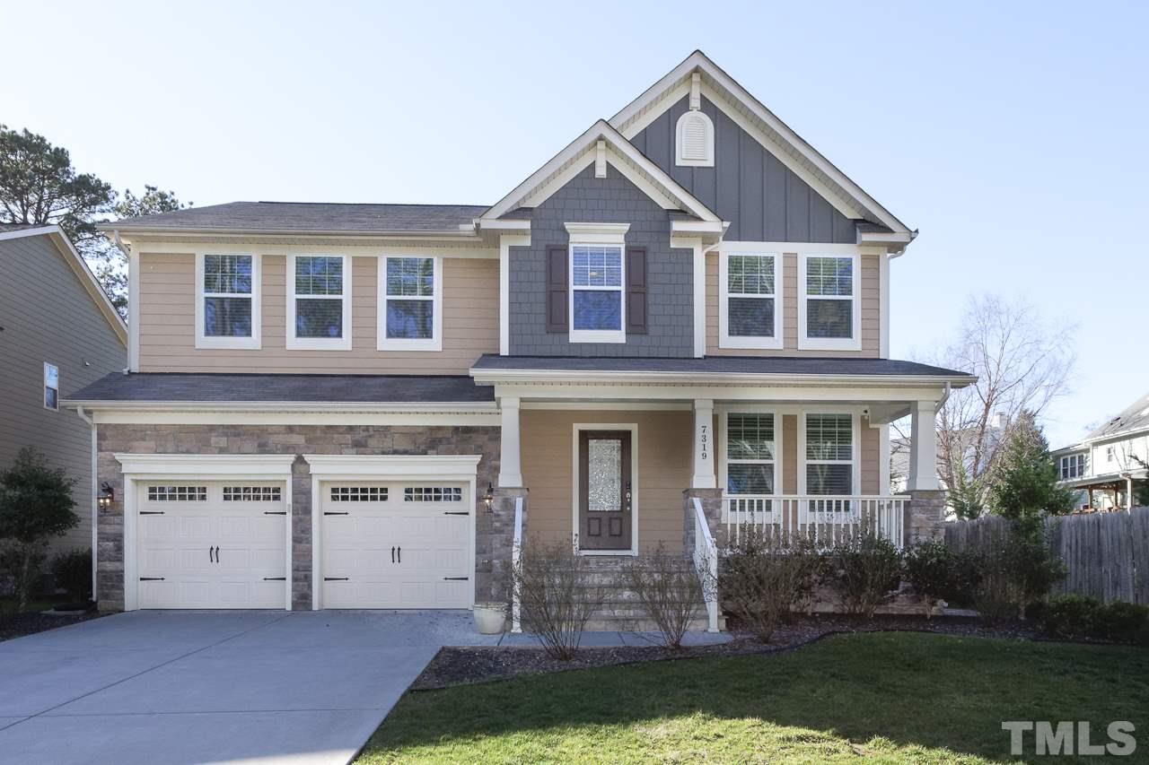 7319 Litchford Road Raleigh, NC 27615 - Photo 1 of 25 a front view of a house with a yard