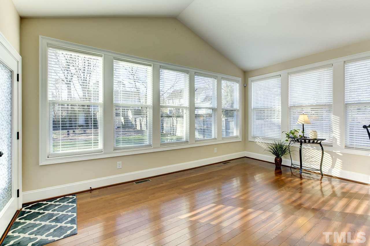 7319 Litchford Road Raleigh, NC 27615 - Photo 11 of 25 a view of an empty room with a window and wooden floor