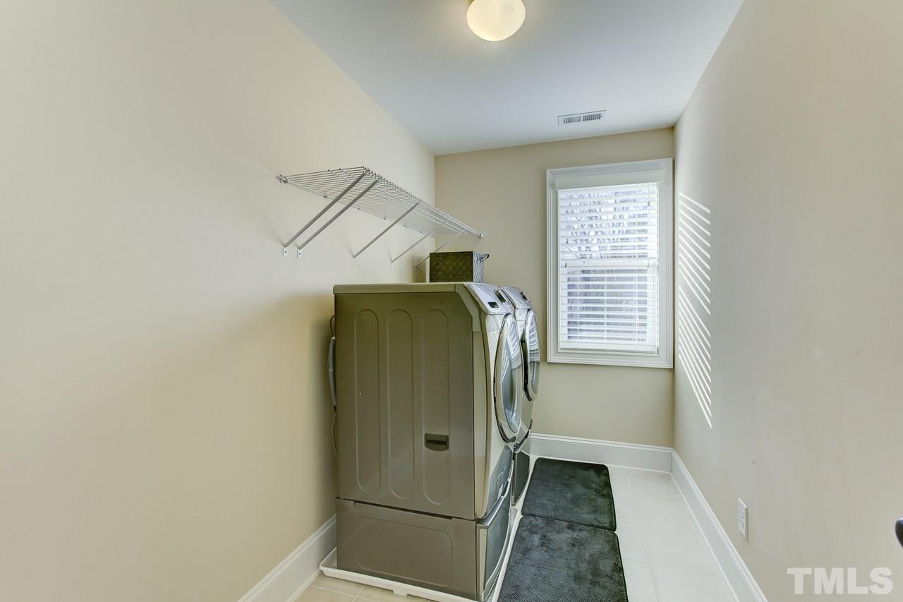 7319 Litchford Road Raleigh, NC 27615 - Photo 22 of 25 a view of walk in closet with window