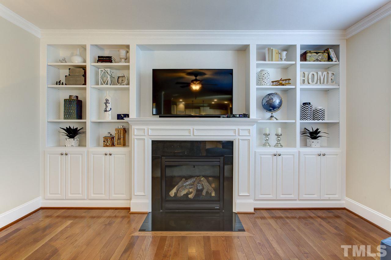 7319 Litchford Road Raleigh, NC 27615 - Photo 7 of 25 a living room with furniture and a fireplace