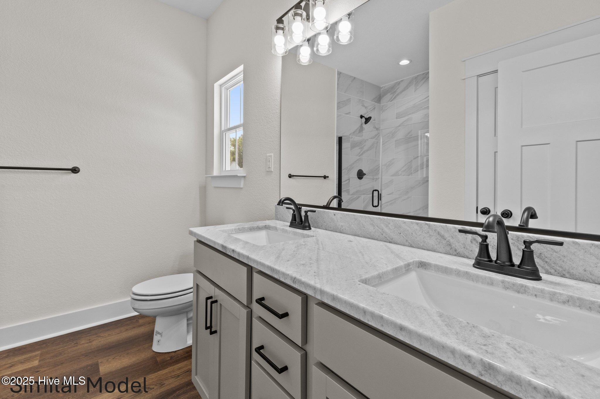 112 Howard Street Camden, NC 27921 - Photo 4 of 17 Primary bath. similar model. colors might vary.