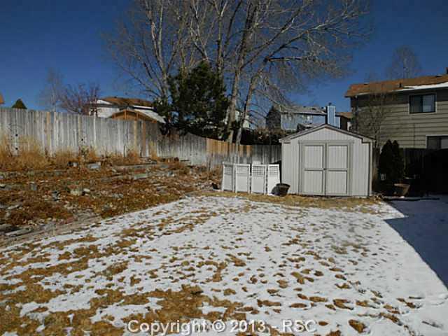 742 Rundle Court Colorado Springs, CO 80911 - Photo 17 of 19 Wonderful lawn, terraced garden and storage shed. Auto sprinkling system.