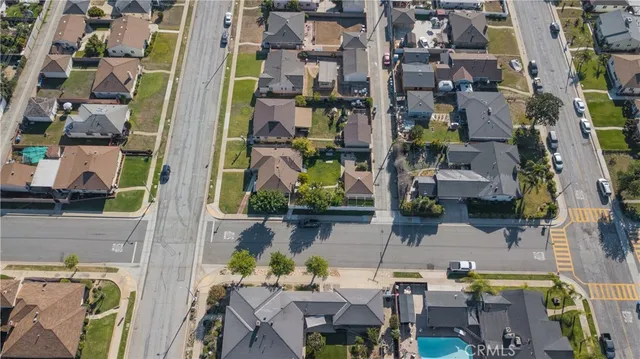 an aerial view of a residential apartment building with a yard
