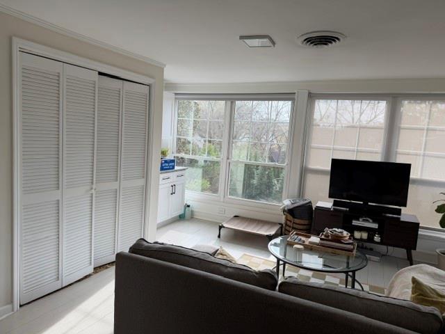 1365 North Highland Avenue Northeast, Unit B Atlanta, GA 30306 - Photo 7 of 11 a living room with furniture and a flat screen tv