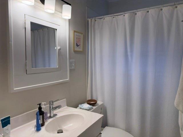 1365 North Highland Avenue Northeast, Unit B Atlanta, GA 30306 - Photo 9 of 11 a bathroom with a sink and a mirror