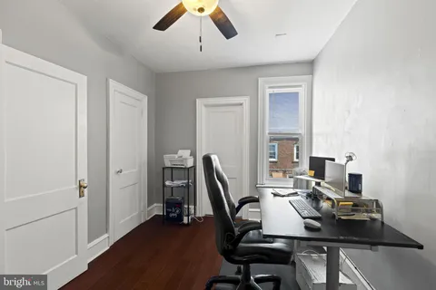 a bathroom with a sink a toilet and shower curtain