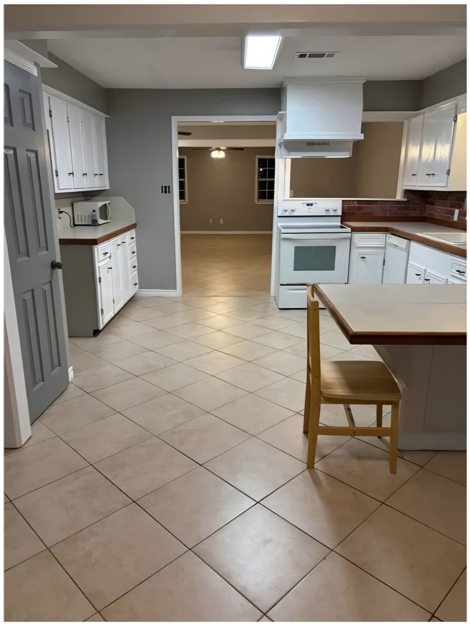 14529 Chapperal Pipeline Road, Unit A Conroe, TX 77302 - Photo 10 of 25 a kitchen with stainless steel appliances granite countertop a stove a sink and a refrigerator