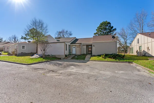 a view of a house with a yard