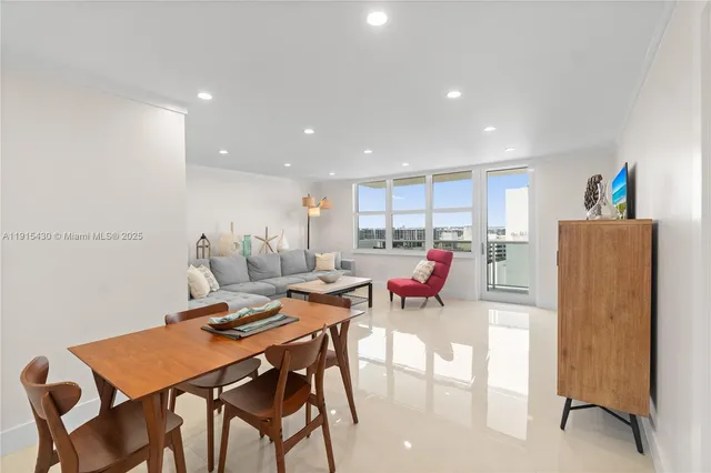 a view of kitchen with refrigerator and furniture